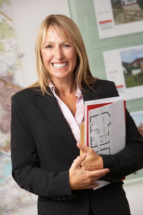 Portrait Of Female Estate Agent In Office 